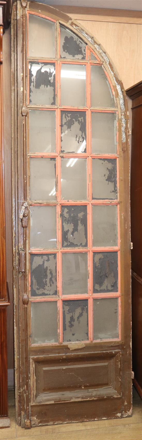 A 19th century French glazed arched door H. approx. 232cm